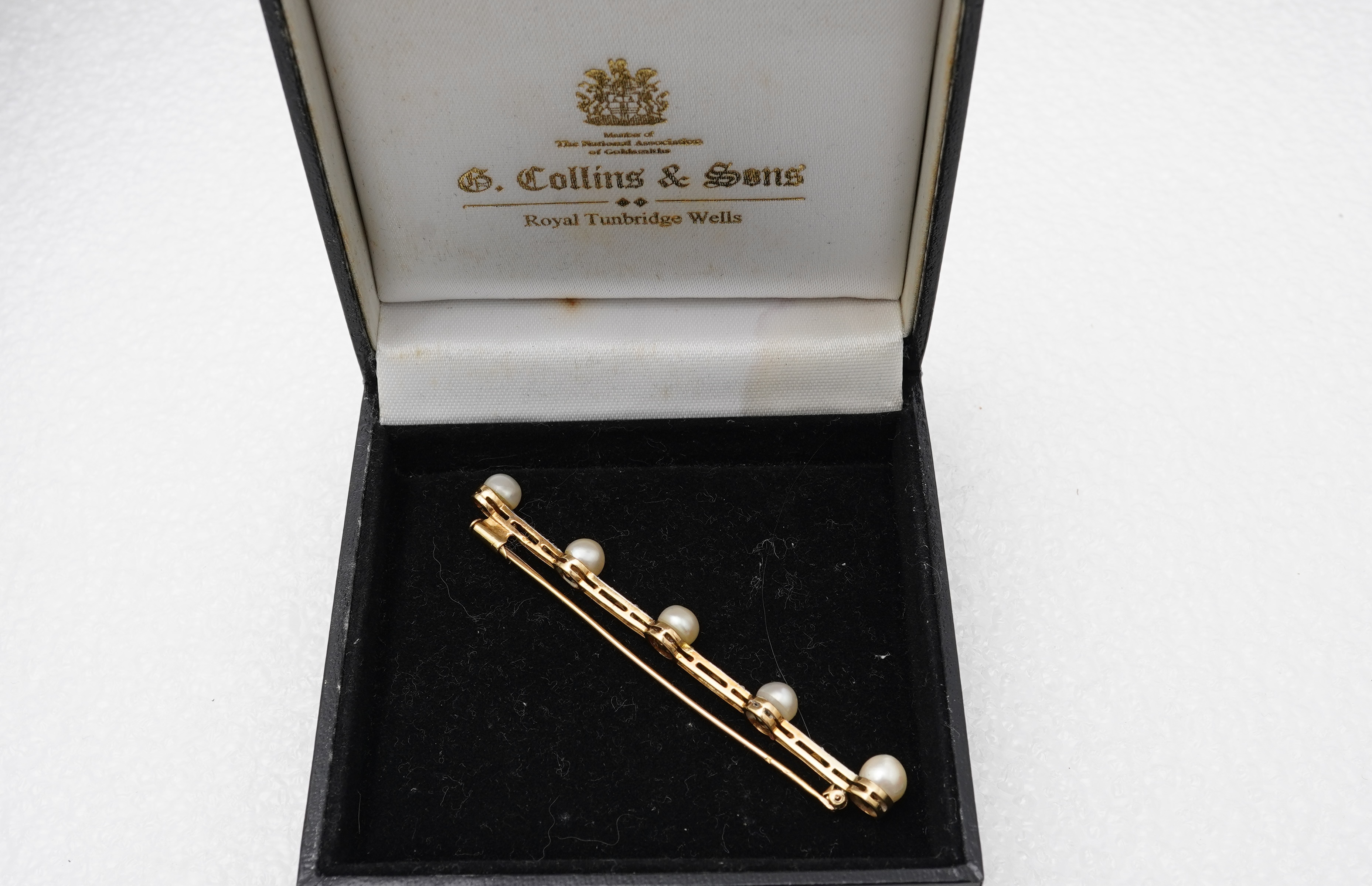 A pearl and diamond bar brooch, France, early 20th century